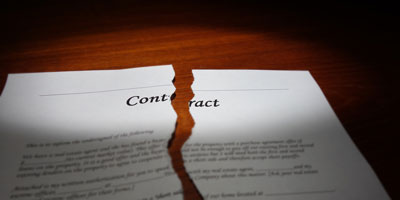 A contract torn in two pieces.